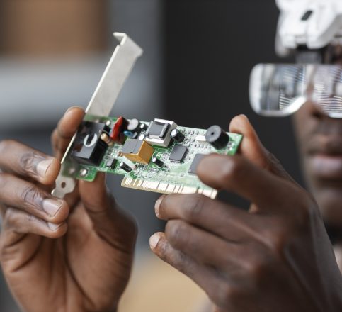 close-up-man-repairing-computer-chips close-up-man-repairing-computer-chips